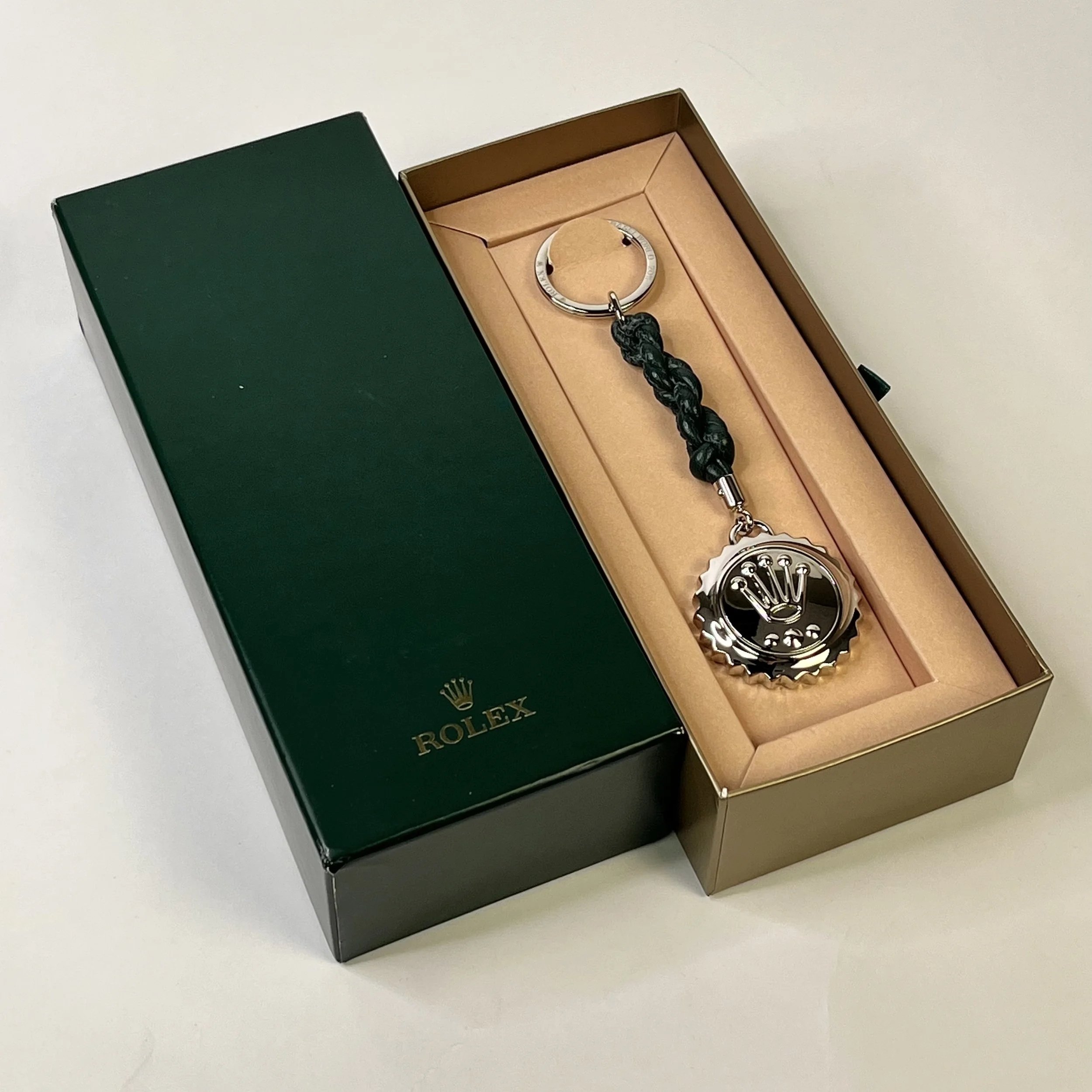 Elegant Rolex novelty keychain featuring a 3D silver crown logo Elegant Rolex novelty keychain featuring a 3D silver crown logo